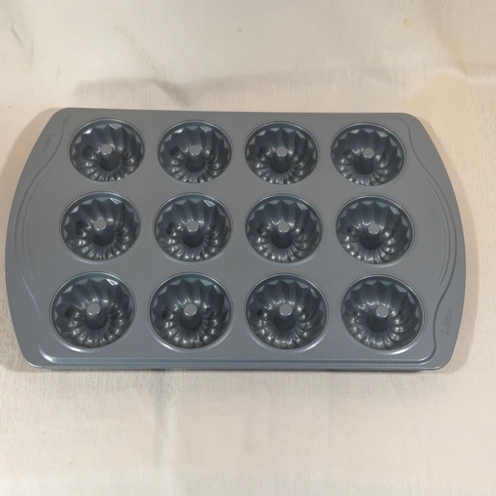 Wilton non-stick 12-cup mini fluted Bundt cake pan.